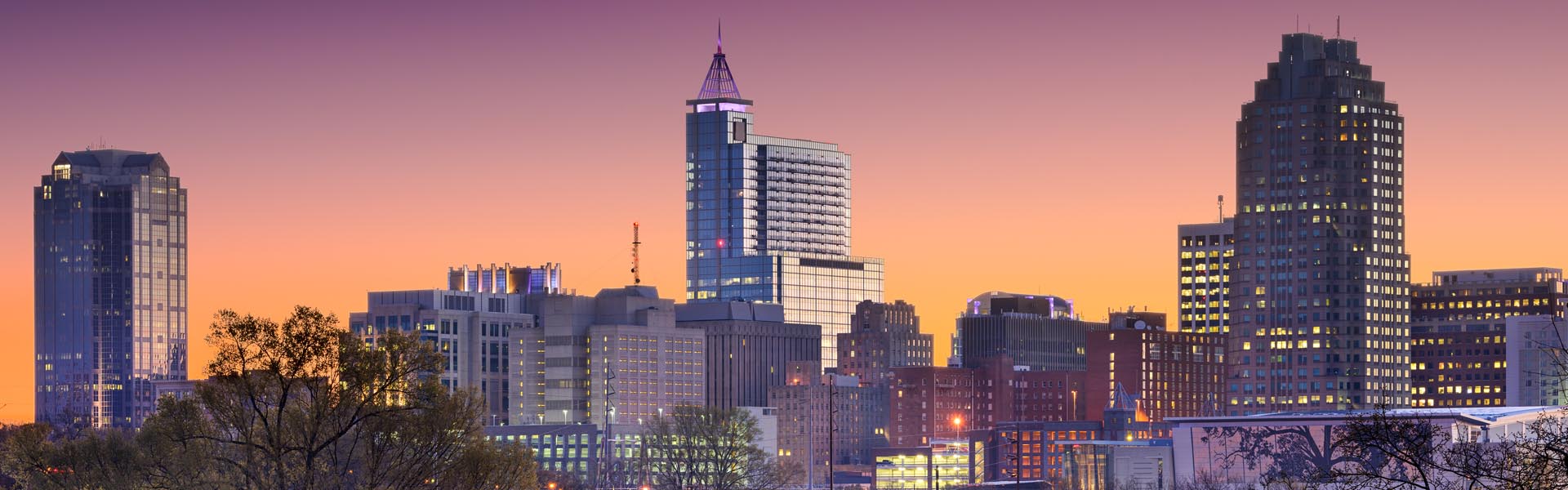 Neon color image of a band playing and people singing along